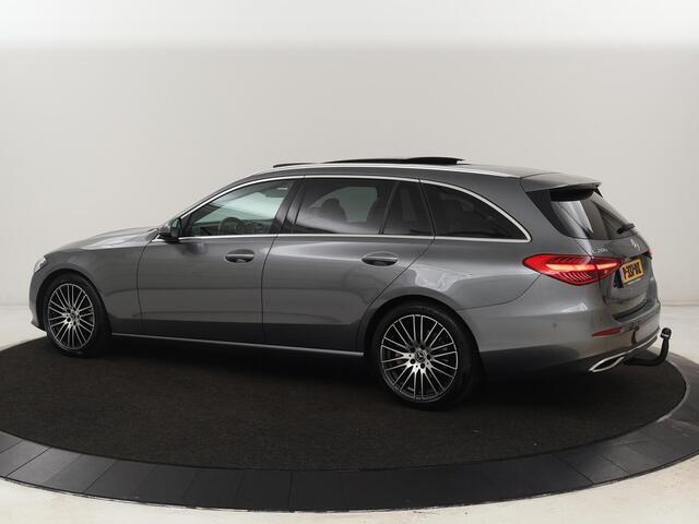 Mercedes-Benz C-KLASSE 200 Launch Edition Luxury Line | Panoramadak | Trekhaak | Leder | Stoelverwarming | Carplay | Camera | Sfeerverlichting | Navigatie | 18'' | Getint glas