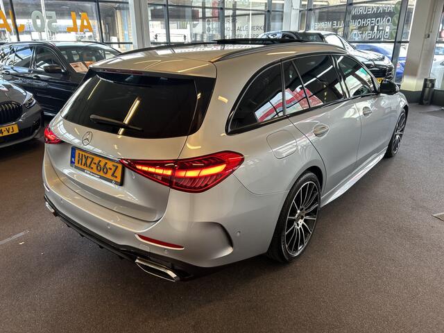 Mercedes-Benz C-KLASSE Estate 180 AMG Line | Panoramadak | Sfeerverlichting | Achteruitrijcamera | Cruise control | Adaptief onderstel | Lane assist | Dodehoeksdetectie | Stoelverwarming | Apple carplay