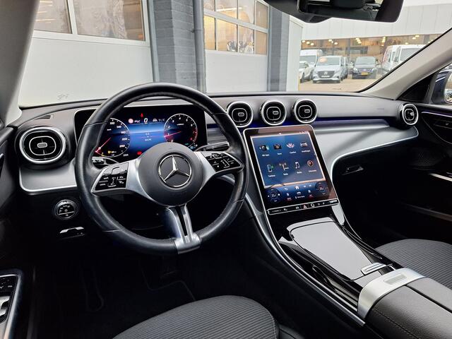 Mercedes-Benz C-KLASSE Estate 200 Launch Edition Luxury Line | Trekhaak | Rijassistentiepakket | Achteruitrijcamera | Sfeerverlichting | Stoelverwarming | Dodehoekassistentie | Elektrische achterklep