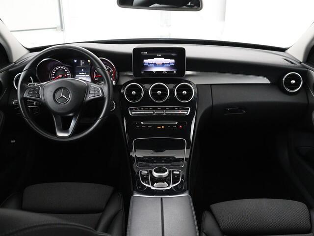 Mercedes-Benz C-KLASSE Estate 180 Business Solution | Half leder | Stoelverwarming | Navigatie | Bluetooth | Camera | Park assist | Cruise control | Climate control | Elektrische achterklep | Trekhaak