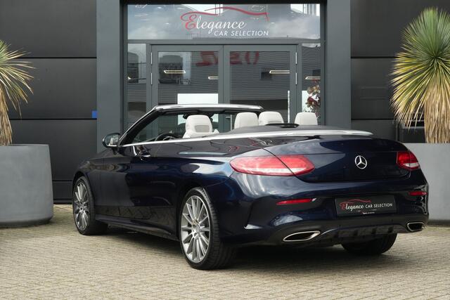 Mercedes-Benz C-KLASSE Cabrio 400 4MATIC AMG Prestige | 334PK | Burmester | Airscarf | 360° Een bijzonder fraaie Mercedes-Benz C 400 4MATIC Cabriolet met de krachtige 3.0 liter V6-benzinemotor, goed voor maar liefst 334 PK en 480 Nm koppel. Dankzij de 4MATIC vierwielaandrijving en d