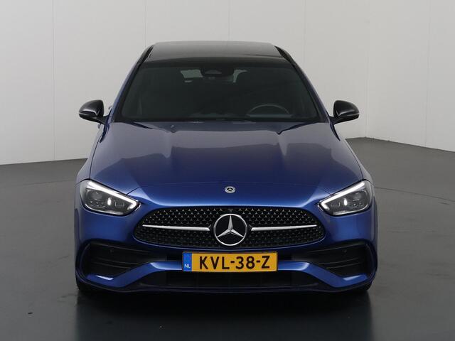Mercedes-Benz C-KLASSE 300 e AMG Line | Trekhaak | 360 graden camera | Night | Panoramadak | Digital Light | Memory stoelen |
