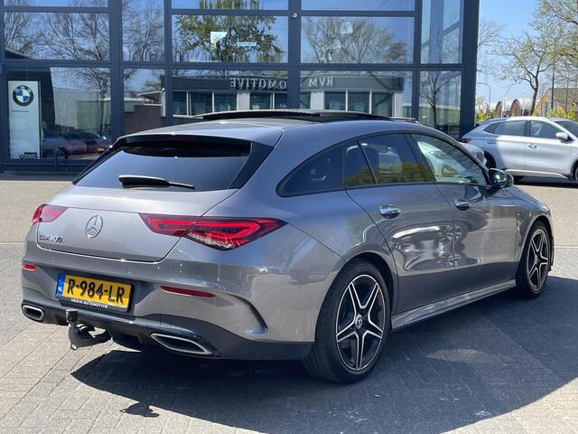 Mercedes-Benz CLA-KLASSE Shooting Brake 200 Business Solution AMG VAN: 36.900,- VOOR: 34.877,- UW LENTEVOORDEEL: 2.023,- AMBILIGHT | CAMERA | TREKHAAK | PANORAMADAK | ELECTR A.KLEP.