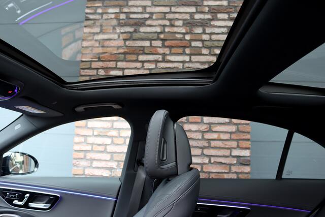 Mercedes-Benz E-KLASSE 400 e 4MATIC AMG Line | Hyperscreen | Luchtvering | Achterasbesturing | Distronic+ | HUD | Massage | Burmester | Nappa Leder | Trekhaak | Vlakkenverwarming | Stoelventilatie | Soft-Close |