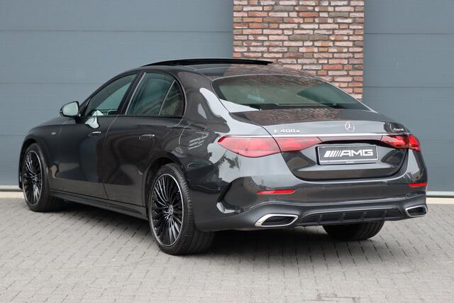 Mercedes-Benz E-KLASSE 400 e 4MATIC AMG Line | Hyperscreen | Luchtvering | Achterasbesturing | Distronic+ | HUD | Massage | Burmester | Nappa Leder | Trekhaak | Vlakkenverwarming | Stoelventilatie | Soft-Close |