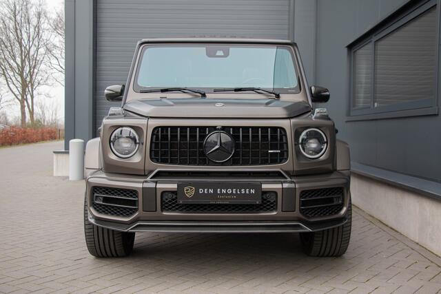 Mercedes-Benz G-KLASSE - 63 AMG 585PK | Burmester 3D | Massage + Ventilatie | Akrapovic | 360 Camera | Carbon | IWC | Lane & Side Assist | MBUX | TH 3500kg | 22"| Manufaktur | Ambiance | Garageopener | N.P ¤275.681,-