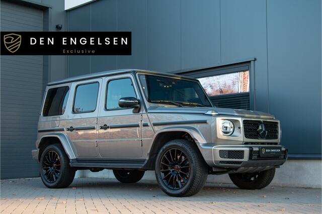 Mercedes-Benz G-KLASSE 500 AMG | ACC | 360 Cam | Burmester 4D | Massage & Ventilatie | Carbon | Lane & Side Assist | Trekhaak 3500kg | Dynamic Select | Garagedeuropener | Treeplanken | Sfeerverlichting | Dealer Onderhouden | Nightpakket | Mojavezilver Metallic | Stoel & Bankver