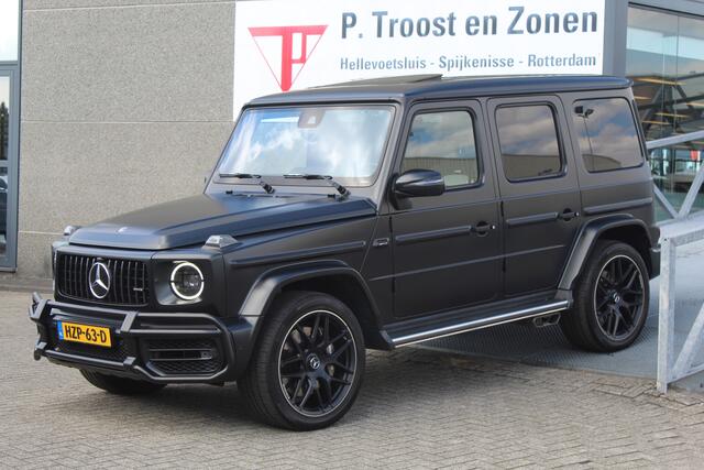 Mercedes-Benz G-KLASSE 63 AMG Manufaktur/Night pakket/Magno matt/Panoramadak/Burmester/Sfeerverlichting/Entertainment schermen/Akrapovic/AMG active ride control/Elektrisch verstelbare stoelen met memory + massage/Stoel verwarming + koeling/360° camera/voorruitverwarming/IWC/Ala