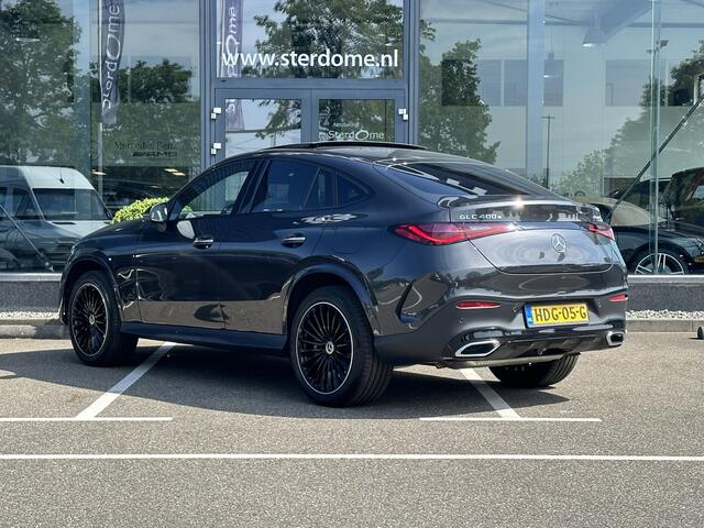 Mercedes-Benz GLC-KLASSE Coupé 400e 4MATIC AMG Line l Panoramadak l MBUX l Niveau regeling l Multibeam LED l Rij- assistentie pakket met Distronic l Keyless l Zwart Leder l Memory pakket l Burmester l Sfeerverlichting l THERMOTRONIC l Smartphone integratie pakket l Night pakket l