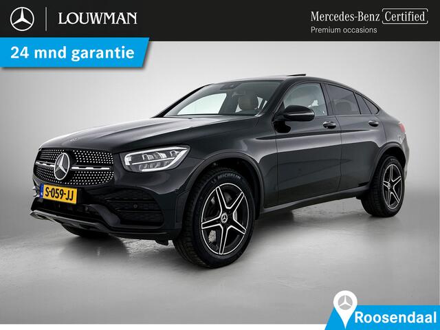 Mercedes-Benz Glc Coupé 300e AMG Nightpakket | Schuif-Kanteldak | Trekhaak | Zadelbruin Interieur | Sfeerverlichting | Stoelverwarming | CarPlay | LED | Inclusief 24 maanden Mercedes-Benz Certified garantie voor Europa.