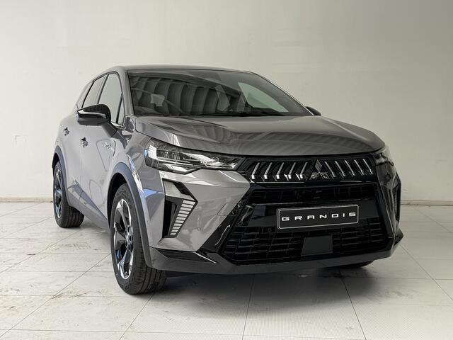 Mitsubishi GRANDIS 1.8 HEV Intense+ NIEUW UIT VOORRAAD LEVERBAAR | Verwarmbare voorstoelen | Parkeersensoren voor- en achter | Sfeerverlichting | Regensensor | Adaptieve Cruise Control | Verwarmbaar Stuurwiel | Apple CarPlay & Android Auto | 8 jaar fabrieksgarantie