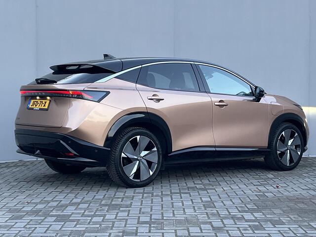Nissan Ariya Evolve 91 kWh Automaat / WLTP bereik 516 km / Trekgewicht 750 kg / CCS snelladen / Elektrisch Glazen Schuif- en Kanteldak / Elektrisch Verstelbare Voorstoelen met geheugenset / Adaptieve Cruise Control / Keyless Entry & Start / Stoelventilatie / Stuur-,