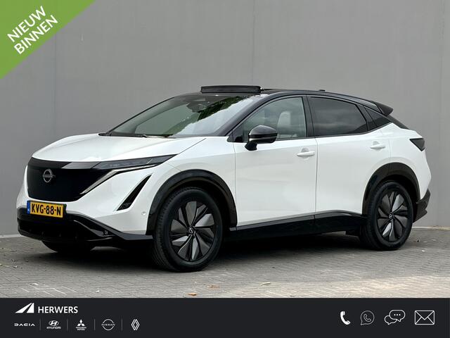 Nissan Ariya e-4ORCE Evolve 91 kWh 4WD / 306 PK / Leder / 1.500 kg Trekgewicht / Warmtepomp / 10 jaar Nissan More Garantie / Stoelverwarming voor en achter / Schuif-kantel dak / Stoelventilatie / Stuurverwarming / Rondomzicht camera / Elektrisch verstelbare stoelen met geheugen / Elektrische achterklep / Adaptieve cruise control / Apple Carplay/Android Auto /