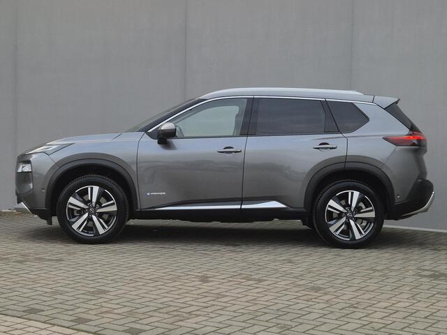 Nissan X-TRAIL 1.5 e-4orce Tekna 4WD Automaat / Fabrieksgarantie tot 05-2027 / Allseason banden / Trekgewicht 1.800 Kg / Head Up Display / Stuur-, Stoel en Achterbank verwarming / Adaptief CC / Elektrische achterklep /