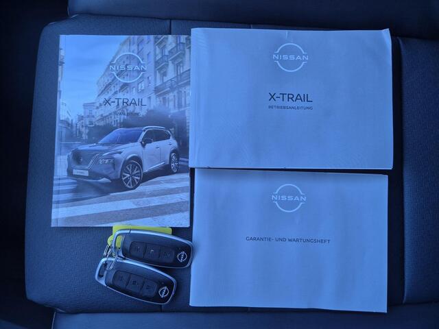 Nissan X-TRAIL 1.5 e-Power Tekna Automaat / Fabrieksgarantie tot 04-2028<100.000 / All season banden / Head Up Display / Elektrische achterklep / Glazen schuif- en kanteldak / Stuur-, Stoel & Achterbank verwarming / Adaptief cruise control /