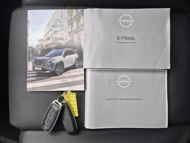 Nissan X-TRAIL 1.5 e-Power e-4ORCE TEKNA 4WD Automaat / Fabrieksgarantie tot 10-2028<100.000km / Dealer onderhouden / All Season banden / Trekgewicht 1800 kg / Head Up Display / Elektrische achterklep / Adaptief cruise control / Rondomzicht camera /