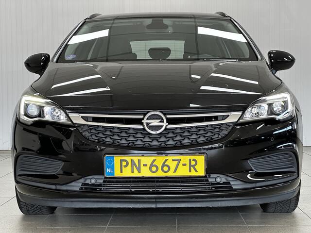 Opel ASTRA Sports Tourer 1.0 Online Edition/ Apple + Android/ DAB+/ Navi/ Airco/ Cruise/ Elek. pakket/ Isofix/ Bluetooth/ Armsteun/ Multi. LEDER. Stuur/ PDC V+A.
