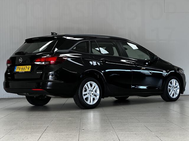 Opel ASTRA Sports Tourer 1.0 Online Edition/ Apple + Android/ DAB+/ Navi/ Airco/ Cruise/ Elek. pakket/ Isofix/ Bluetooth/ Armsteun/ Multi. LEDER. Stuur/ PDC V+A.