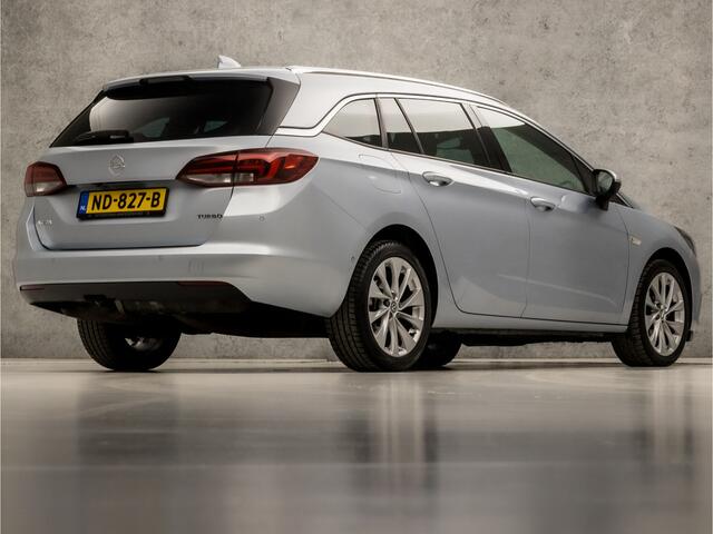 Opel ASTRA Sports Tourer 1.4 Innovation 150Pk Automaat (APPLE CARPLAY, GROOT NAVI, CLIMATE, CAMERA, LEDER, SPORTSTOELEN, ADAPTIVE CRUISE, PARKEERSENSOREN, LANE ASSIST, NIEUWE APK, NIEUWSTAAT)