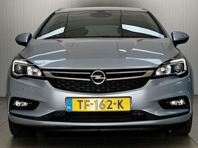 Opel ASTRA Sports Tourer 1.0 Business Executive/ LED Dagrijverl./ 17''LMV/ Apple+Android/ Clima/ Navi/ Cruise/ Lane-Assist/ Elek.Pakket/ Bluetooth/ Multi.LEDER.Stuur/ PDC V+A.