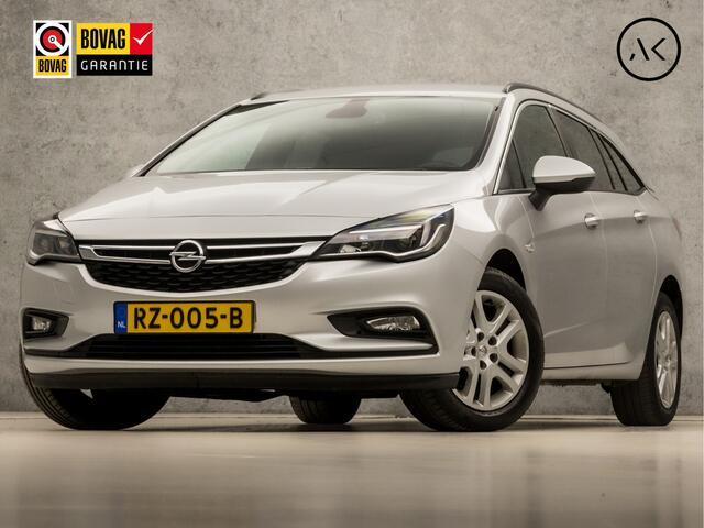 Opel ASTRA Sports Tourer 1.0 Sport (APPLE CARPLAY, GROOT NAVI, CRUISE, GETINT GLAS, SPORTSTOELEN, PARKEERSENSOREN, DAB+, TREKHAAK, ELEK PAKKET, NIEUWE APK, NIEUWSTAAT)