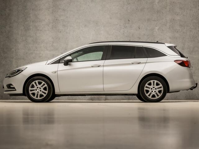 Opel ASTRA Sports Tourer 1.0 Sport (APPLE CARPLAY, GROOT NAVI, CRUISE, GETINT GLAS, SPORTSTOELEN, PARKEERSENSOREN, DAB+, TREKHAAK, ELEK PAKKET, NIEUWE APK, NIEUWSTAAT)