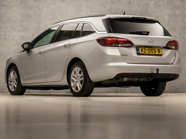 Opel ASTRA Sports Tourer 1.0 Sport (APPLE CARPLAY, GROOT NAVI, CRUISE, GETINT GLAS, SPORTSTOELEN, PARKEERSENSOREN, DAB+, TREKHAAK, ELEK PAKKET, NIEUWE APK, NIEUWSTAAT)