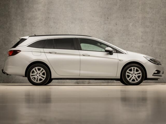 Opel ASTRA Sports Tourer 1.0 Sport (APPLE CARPLAY, GROOT NAVI, CRUISE, GETINT GLAS, SPORTSTOELEN, PARKEERSENSOREN, DAB+, TREKHAAK, ELEK PAKKET, NIEUWE APK, NIEUWSTAAT)