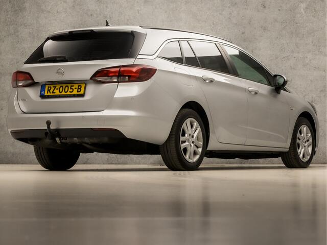 Opel ASTRA Sports Tourer 1.0 Sport (APPLE CARPLAY, GROOT NAVI, CRUISE, GETINT GLAS, SPORTSTOELEN, PARKEERSENSOREN, DAB+, TREKHAAK, ELEK PAKKET, NIEUWE APK, NIEUWSTAAT)