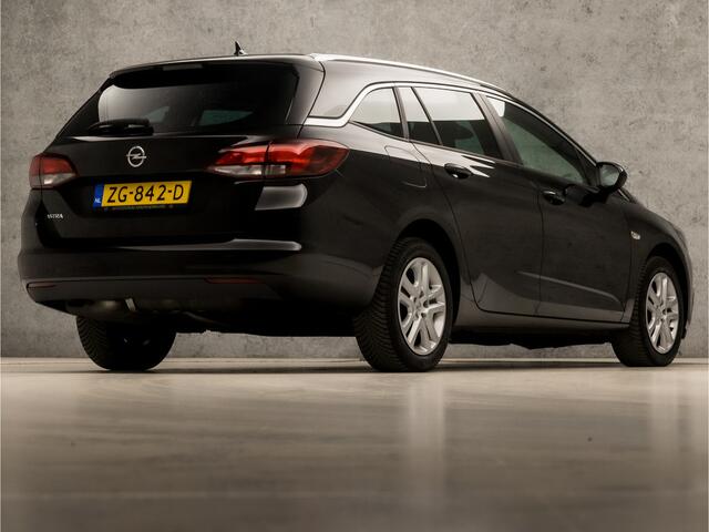 Opel ASTRA Sports Tourer 1.0 Turbo Sport (APPLE CARPLAY, GROOT NAVI, CLIMATE, SPORTSTOELEN, LEDER, PARKEERSENSOREN, GETINT GLAS, LM VELGEN, NIEUWSTAAT)