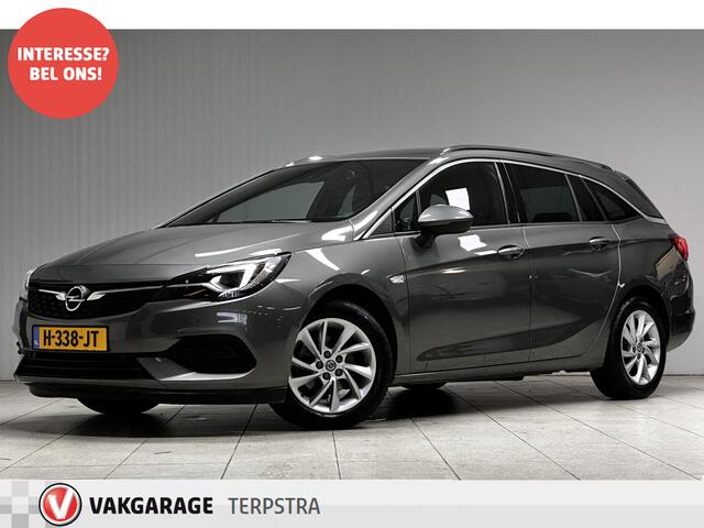 Opel ASTRA Sports Tourer 1.2 Elegance/ Trekhaak!/ LED Koplampen/ Virtual Cockpit/ Dodehoekdetectie/ Camera/ Zwarte Hemel/ Grootlichtass./ Keyless/ DAB+/ Apple+Android/ Clima/ Navi/ Cruise/ Bluetooth/ Multi.LEDER.Stuur/ Elek.Pakket