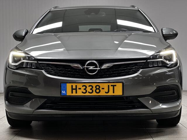 Opel ASTRA Sports Tourer 1.2 Elegance/ Trekhaak!/ LED Koplampen/ Virtual Cockpit/ Dodehoekdetectie/ Camera/ Zwarte Hemel/ Grootlichtass./ Keyless/ DAB+/ Apple+Android/ Clima/ Navi/ Cruise/ Bluetooth/ Multi.LEDER.Stuur/ Elek.Pakket