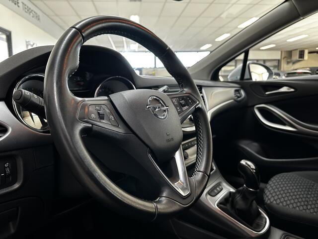 Opel ASTRA Sports Tourer 1.0 Turbo Business/ Apple + Android/ DAB+/ Navi/ Airco/ Cruise/ Elek. pakket/ Isofix/ Bluetooth/ Armsteun/ Multi. LEDER. Stuur/ PDC Achter.
