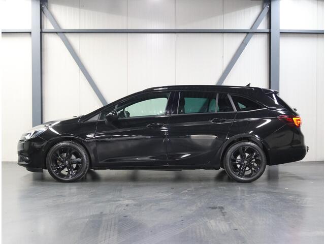 Opel ASTRA Sports Tourer 1.2 Turbo 145PK Ultimate | AppleCarPlay/AndroidAuto | Alcantara | Armsteun | Navigatie | Adaptive Cruise Control | Keyless | AGR Stoelen | Trekhaak | LED | Camera | Climate Control | DAB Radio | Isofix | Privacy Glass | Parkeersensoren |
