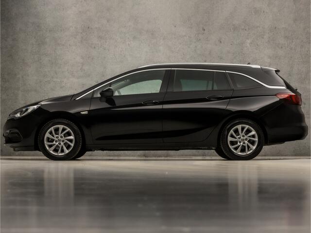 Opel ASTRA Sports Tourer 1.2 Elegance Sport (APPLE CARPLAY, GROOT NAVI, MATRIX LED KOPLAMPEN, KEYLESS, CAMERA, ADAPTIVE CRUISE, GETINT GLAS, LM VELGEN, NIEUWSTAAT)