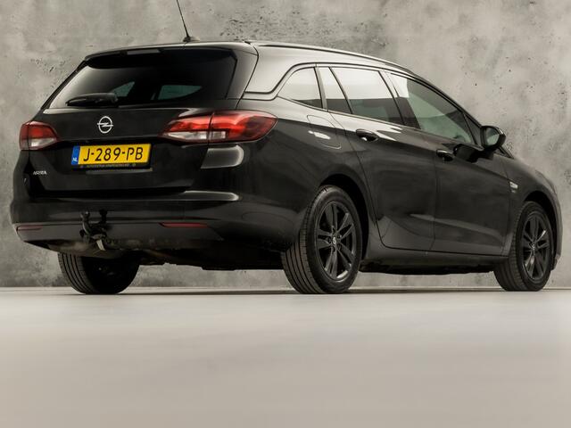 Opel ASTRA Sports Tourer 1.2 Sport (APPLE CARPLAY, CAMERA, CLIMATE, ZWART HEMEL, ADAPTIVE CRUISE, SPORTSTOELEN, GETINT GLAS, TREKHAAK, NIEUWSTAAT)