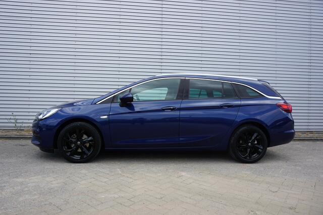 Opel ASTRA Sports Tourer 1.2 Elegance Airco / Navi / Cruise / Camera / Parkeers. / Trekhaak / Lm velgen / NAP