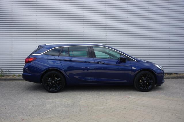 Opel ASTRA Sports Tourer 1.2 Elegance Airco / Navi / Cruise / Camera / Parkeers. / Trekhaak / Lm velgen / NAP