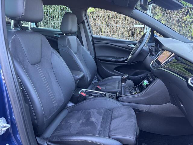 Opel ASTRA Sports Tourer 1.2 Ultimate 2e Eigenaar l Trekhaak l Camera l Carplay l Navi l Alcantara-Leder l 17''Lmv l Stoelverw-Stuurverw l Net beurt gehad l Dodehoek l Rijstrooksensor l Pdc V+A l 6 Bak l N.A.P l 146pk l Bj 11-2020 l Apk tot 08-2028