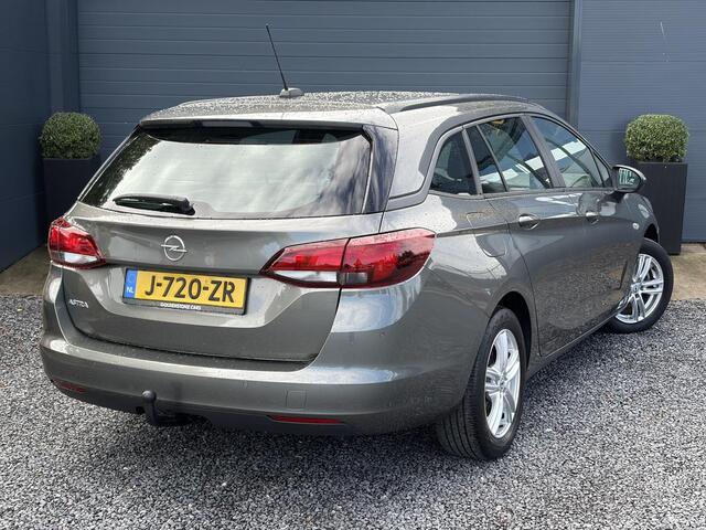 Opel ASTRA 1.2 Business Edition 147pk l 2e Eigenaar l Trekhaak l Navi l Carplay l 6 Bak l Clima l Cruise l Pdc V+A l Recent beurt gehad l Lm velgen l N.A.P l Apk tot 07-2028