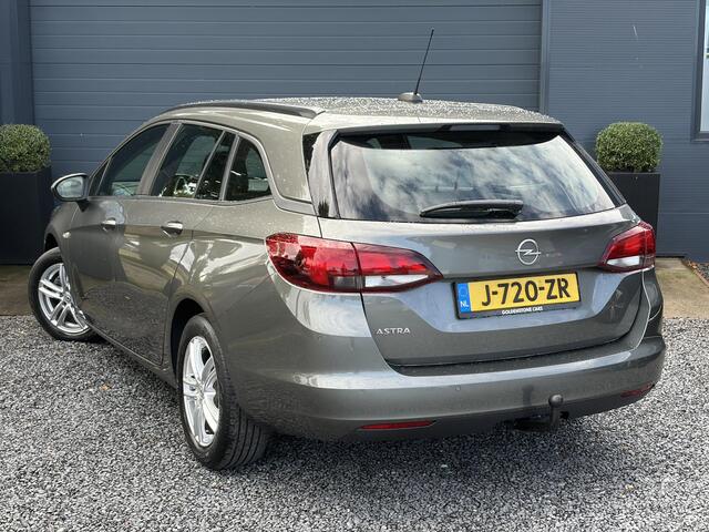 Opel ASTRA 1.2 Business Edition 147pk l 2e Eigenaar l Trekhaak l Navi l Carplay l 6 Bak l Clima l Cruise l Pdc V+A l Recent beurt gehad l Lm velgen l N.A.P l Apk tot 07-2028