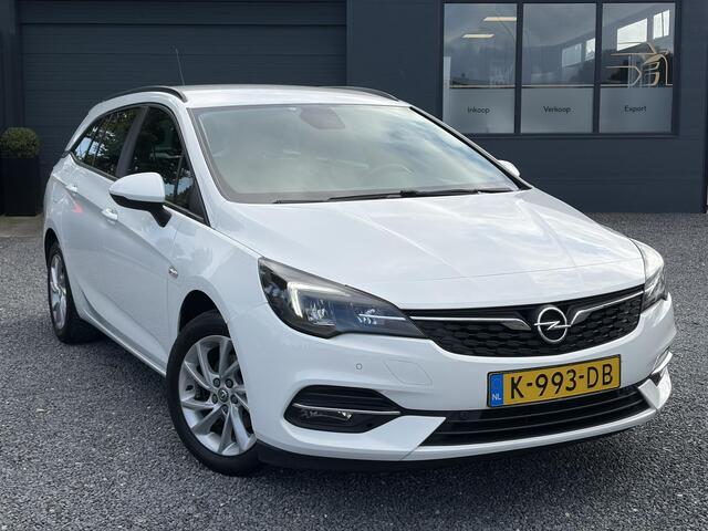 Opel ASTRA Sports Tourer 1.2 Edition ?Camera ?110pk?2e Eigenaar?Carplay?Navi?Airco?Cruise?Pdc?LED koplampen?N.A.P.?6 Bak?Pdc V+A?Lm velgen?Dakdragers ?Comfortstoelen?Bj 11-2020?Apk tot 07-2028