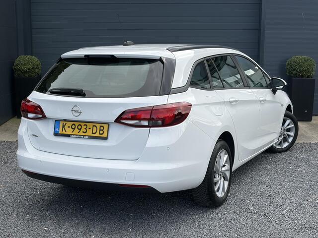 Opel ASTRA Sports Tourer 1.2 Edition ?Camera ?110pk?2e Eigenaar?Carplay?Navi?Airco?Cruise?Pdc?LED koplampen?N.A.P.?6 Bak?Pdc V+A?Lm velgen?Dakdragers ?Comfortstoelen?Bj 11-2020?Apk tot 07-2028
