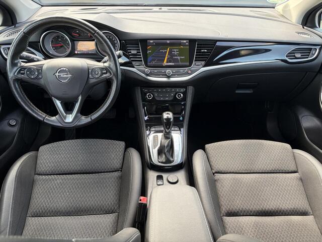 Opel ASTRA Sports Tourer 1.4 Business Executive ?2 Eigenaar?Camera?Navi?Trekhaakt?Carplay?Stoelverw?Stuurverw?Automaat?Dealer Onderhouden?Keyless?Clima?Cruise?Pdc V+A?Halfleder?Comfortstoelen?150pk?Rijstrooksensor?Dodehoeksensor?Elekt Stoelen?Lm velgen?N.A.P?Apk tot 03-2027