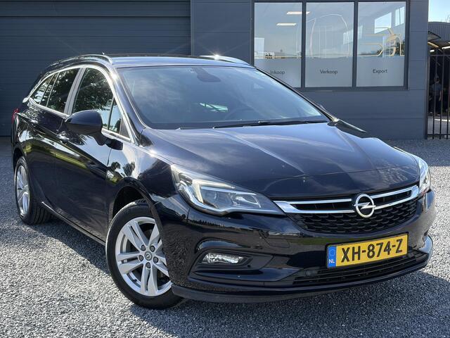 Opel ASTRA Sports Tourer 1.4 Turbo Online Edition ?150pk?2e Eigenaar?Camera?Carplay?Navi?Pdc V+A?Stoelverw?Stuurverw?Clima?Cruise?Lm velgen?6 Bak?Comfortstoelen?Dealer Onderhouden?N.A.P?Bj 12-2018?Apk tot 01-2027