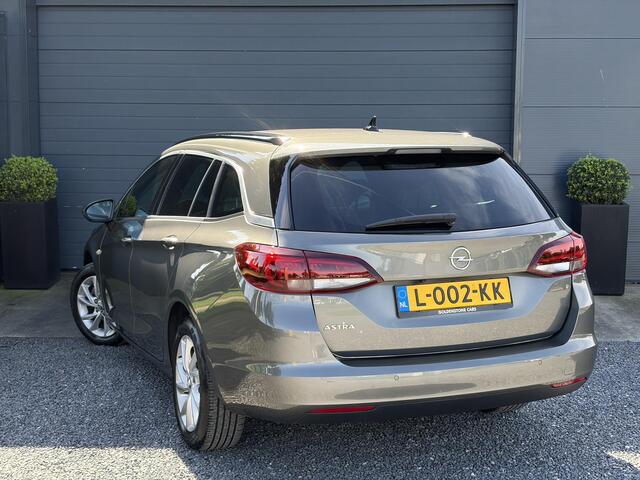 Opel ASTRA Sports Tourer 1.2 Business Elegance ?1e Eigenaar?110pk?Carplay?Camera?Navi?Clima?Cruise?Halfleder?Comfortstoel?Pdc V+A?6 Bak?Dealer Onderhouden?Keyless?Lm velgen?N.A.P?Apk tot 06-2027