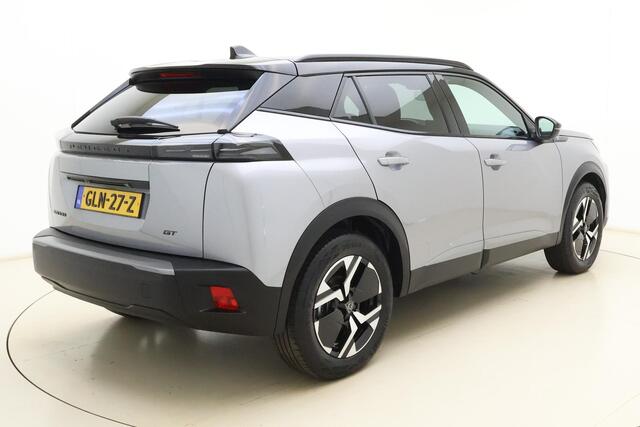 Peugeot e-2008 EV GT 54 kWh | Achteruitrijcamera | Parkeersensoren | Adaptive cruise control | Wireless charging | Navigatie | Airco | Climate control | Stuurbediening | Interieurverlichting | Half stof/leer bekleding | Verkeersbord detectie