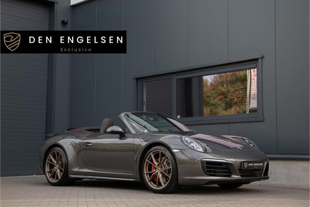 Porsche 911 Cabrio 3.0 Carrera 4S 420PK | Lift | Sportuitlaat | Achterasbesturing | Ventilatie | Bose | Sport Chrono | Memory | Stuurverwarming | Camera | NL Auto (nap) | Keyless | Alarm | Dealer OH. ¤196.844,- Nieuwprijs