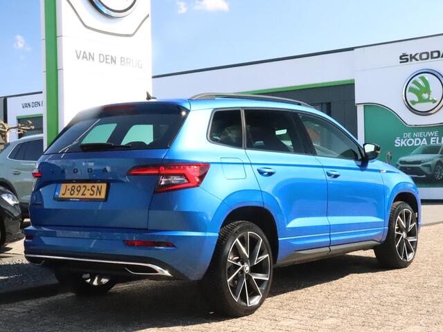 Skoda Karoq Sportline Business 1.5 TSI 150pk AUTOMAAT | Trekhaak | CANTON Audio | Elektrische Achterklep | Adaptieve Cruise Control | Stoel- & Stuurverwarming | Achteruitrijcamera |