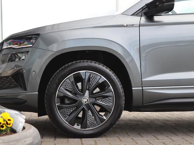 Skoda Karoq 1.5 TSI 150 pk DSG ACT Sportline Business | Navigatie | Keyless | LED | 360° camera | Stoel + Achterbank Verwarming | Voorruit Verwarming | Adaptive Cruise | Stuurverwarming | Standkachel |